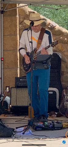 Full band with purple stage lighting